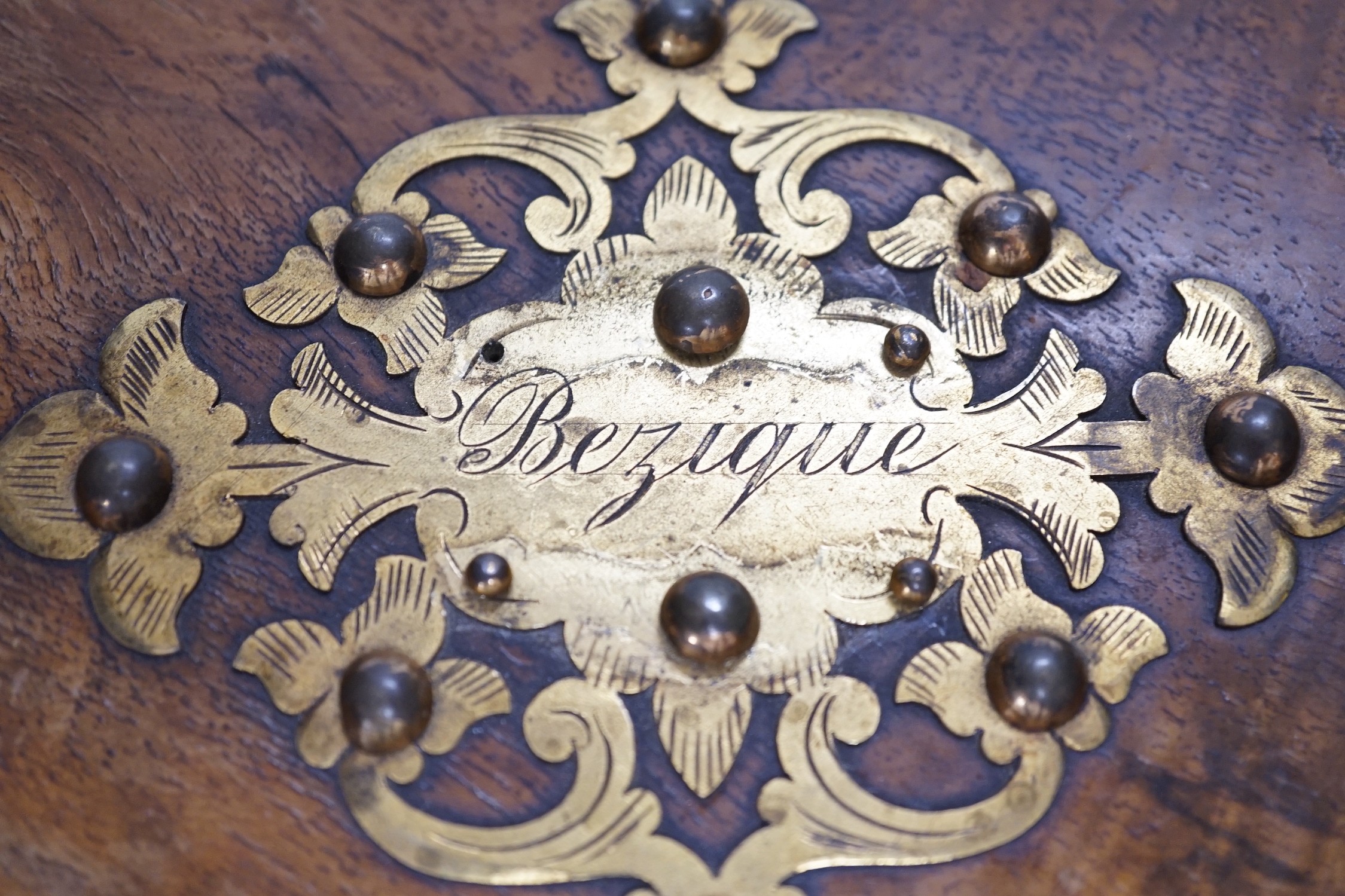 A Victorian walnut and brass 'Bezique' games box and a rosewood box. Largest 23cm wide